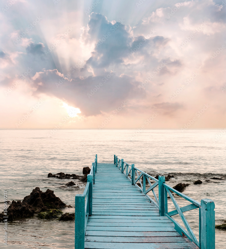 Wood bridge on the sea which has walk way for travel with beautiful sky and sunshine background. - obrazy, fototapety, plakaty 