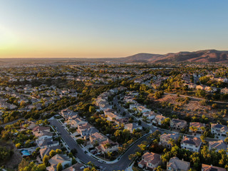 Wall Mural - Aerial view of residential modern subdivision luxury house neighborhood during sunset. South California, USA
