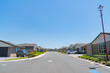 New subdivision street with uniform homes.