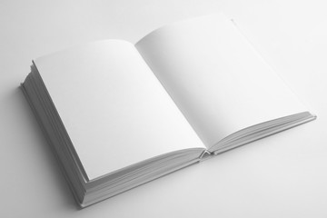 Open book with blank pages on white background. Mock up for design