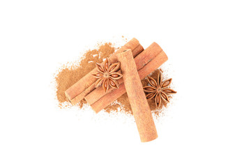 Poster - Cinnamon powder, sticks and anise isolated on white background