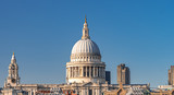 Fototapeta Londyn - View from Millennium bridge of Saint Paul's Cathedral with blue sky on a sunny day