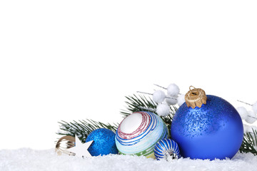 Colorful christmas balls with fir tree branches on white background