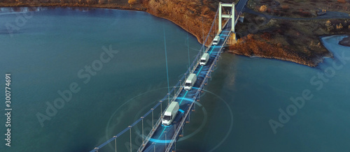 Fotografía Autonomous Electric Van semi truck car driving on a highway with technology assi