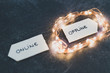 © faithie - social media lifestyle concept, Online and Offline alternatives on signs pointing at opposite directions and led lights emphasizing the Offline option