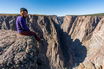 Woman Doing Handstands and Looking over the Black Canyon of the Gunnison