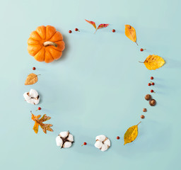 Wall Mural - autumn theme with orange pumpkin - flat lay