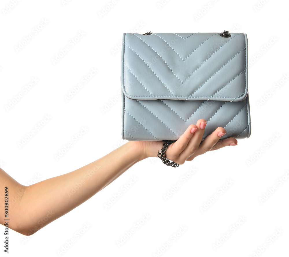 Female hand with leather bag on white background