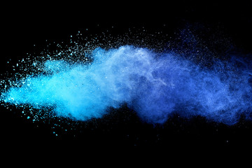 Wall Mural - Blue sky color powder explosion on black background.