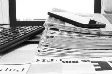 Wall Mural - News. Newspapers, Laptop and Smartphone - Sources of Information. Finance Magazines and Journals Stacked in Pile on Keyboard of Computer. Business Concept