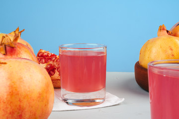 Sticker - Glass of pomegranate juice and fruits on a table