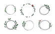 Set of 6 circle cute hand drawn frames on the white background. Doodle hand drawn decorative outlined wreaths with branches, leaves and flowers. Vector illustration. Circle frames