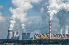 Power Plant In Bełchatów, Poland. Coal-fired Power Station With Steam Billowing From High Chimneys