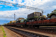 Cargo Train Carrying Military Vehicles On Railway Flat Wagons