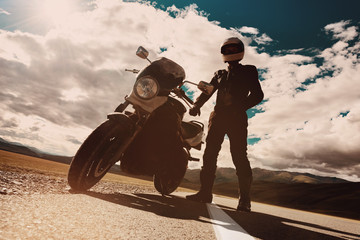 Confident motorbike and biker on straight road