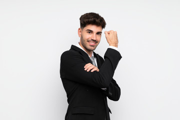 Young businessman over isolated white background making strong gesture