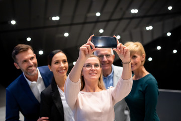 Wall Mural - Business people team selfie photo at conference hall