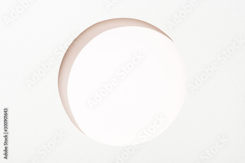Fotografía cut out round hole in white paper on white background