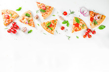 Pieces Of Cheese Pizza Margarita With Ingredients And Herbs. White Stone Background Top View