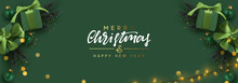 Holiday Banner Merry Christmas And Happy New Year. Xmas Design With Realistic Objects, Realistic Dark Green Color Gift Box, Balls, Light Lamps Garland, Glitter Gold Confetti. Festive Horizontal Poster