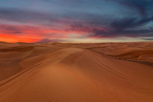 Sunset Sky Sand Desert Landscape, With Dunes And Red Dramatic Sunset Picturesque View