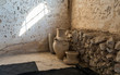 Clay jugs in the reconstructed building of the Byzantine era in the archaeological site Ancient Shiloh in Samaria region in Benjamin district, Israel