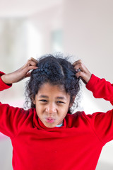 girl itchy his hair on isolated w indoors background, health care concept