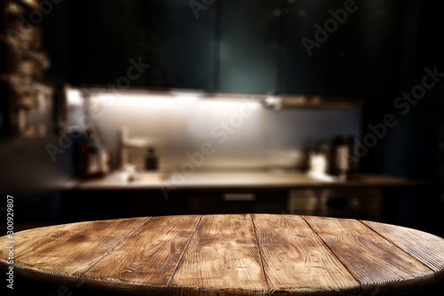 Fotomural Wooden table background of free space for your decoration and blurred background of kitchen