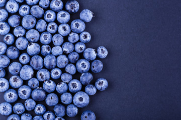 top view photography blueberries stack on black background. copyspace for your text design