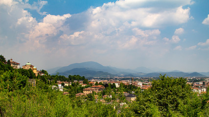 Wall Mural - Beautiful buildings on the hills. Bergamo. Beautiful,  panoramic view. Journey to Italy. Green Summer Landscape. 