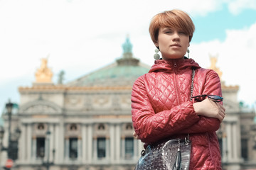 blonde woman portrait in front of Opera theater Paris, France.