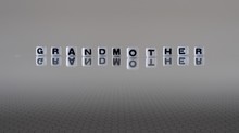 The Concept Of Grandmother Represented By Black And White Plastic Letter Cubes
