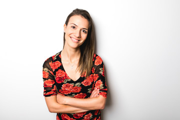 thirty woman standing with arms crossed on white background.