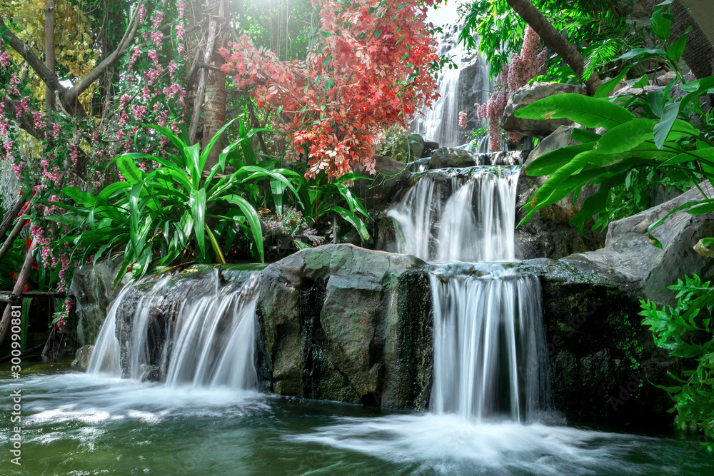 Artificial tropical garden waterfall - obrazy, fototapety, plakaty 