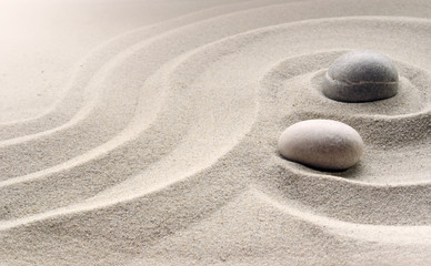 zen garden meditation stone background with stones and lines in sand for relaxation balance and harmony spirituality or spa wellness