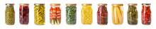 Jars With Different Canned Vegetables On White Background