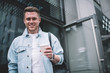 © BullRun - Happy trendy man with coffee cup