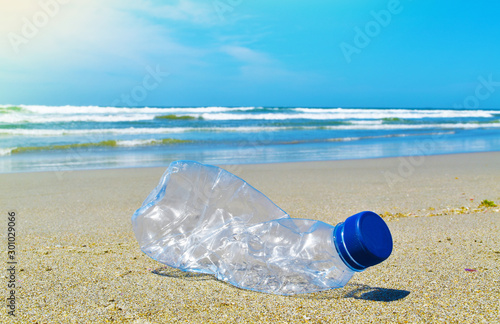 Plastic water bottles pollution on the beach. Illustration concept environmental, ecological problem, ocean plastic pollution.