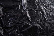 Top View Of Black Plastic Bag Texture And Background. Reduction Of Plastic Bags For Natural Treatment. Recycle And World Environment Day Concept.