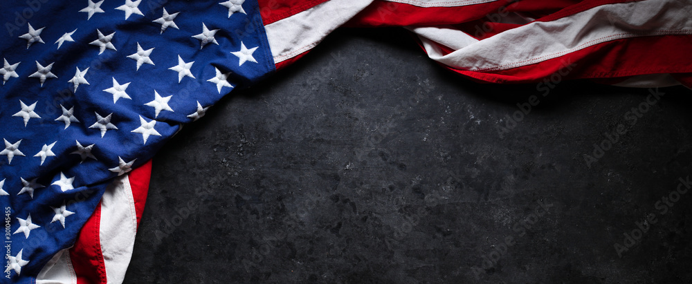US American flag on worn black background. For USA Memorial day, Veteran's day, Labor day, or 4th of July celebration. With blank space for text. - obrazy, fototapety, plakaty 