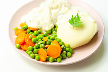 Cod fillet with a creamy cheese sauce, with mashed potato, peas and carrots