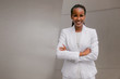 Smiling cheerful headshot portrait of an african businesswoman, corporate executive, business career professional in swanky stylish suit