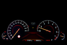 Close Up Shot Of A Red Speedometer In A Car. Car Dashboard. Dashboard Details With Indication Lamps.Car Instrument Panel. Dashboard With Speedometer, Tachometer, Odometer. Car Detailing.