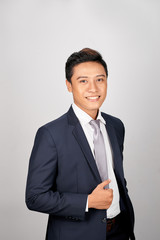 Portrait of young handsome Asian businessman on white background