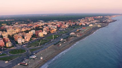 Wall Mural - Flight on drone above Italian sea resort sandy beach Ostia and sea water, aerial view