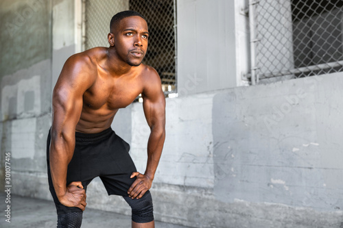 Fotomural Lifestyle of african american athlete preparing for run, jogging, intense convic