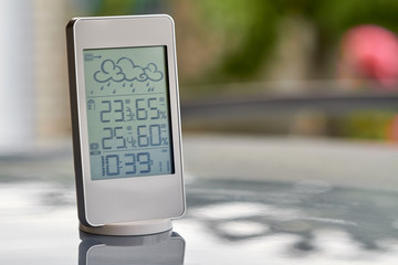 Wall Mural - Best personal weather station device with weather conditions inside and outside. Home digital weather forecast concept with temperature and humidity.