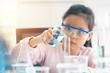 © sutlafk - little asia kids girl in lab learning chemistry in.