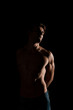 © LIGHTFIELD STUDIOS - shirtless sensual man posing isolated on black