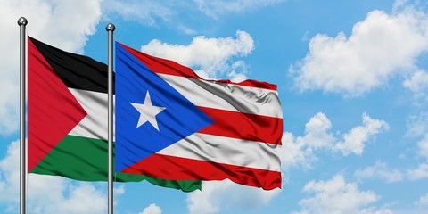 Palestine and Puerto Rico flag waving in the wind against white cloudy blue sky together. Diplomacy concept, international relations.